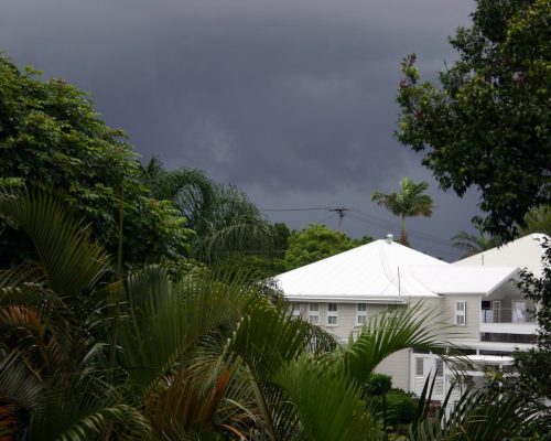 Storm clouds over house