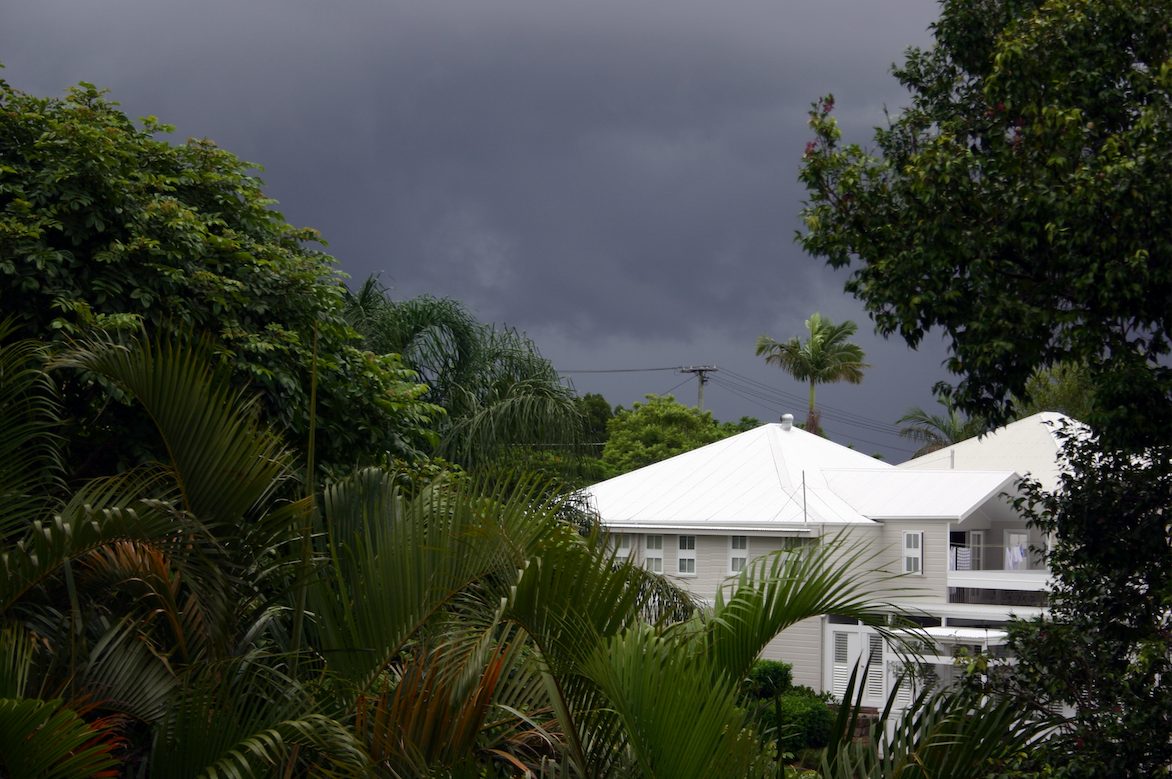 Storm clouds over house
